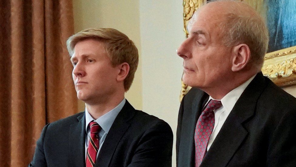Nick Ayers (L), chief of staff to U.S. Vice President Mike Pence, and White House Chief of Staff John Kelly look on as U.S. President Donald Trump holds a cabinet meeting