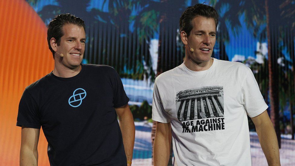 Tyler Winklevoss and Cameron Winklevoss (L-R), creators of crypto exchange at the Bitcoin 2021 Convention, Florida.