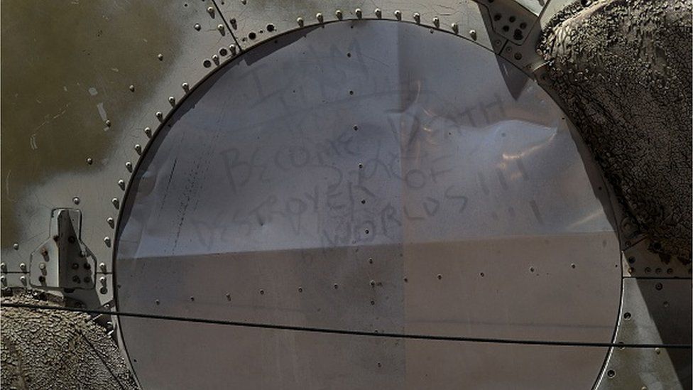 The words of Robert Oppenheimer, an inventor of the atomic bomb, are seen written in dust on part of a deactivated nuclear missile at the Pima Air and Space Museum May 13, 2015 in Tucson, Arizona. Robert Oppenheimer quoted Bhagavad-Gita saying "Now I am become Death, the destroyer of worlds".