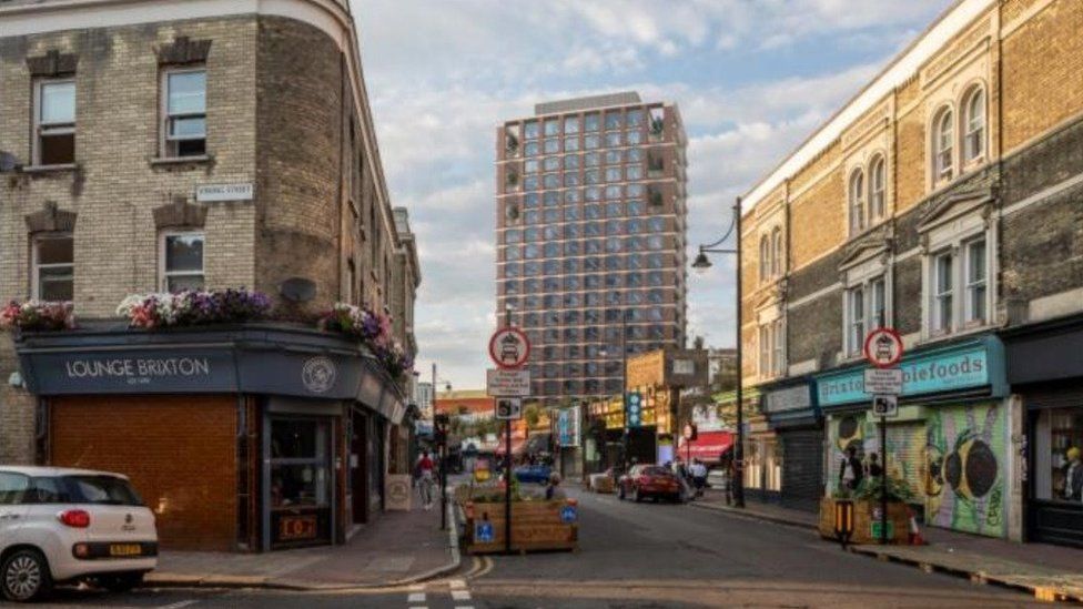 A CGI composite of Atlantic Road in Brixton, showing the elevation of the tower block high above surrounding buildings.