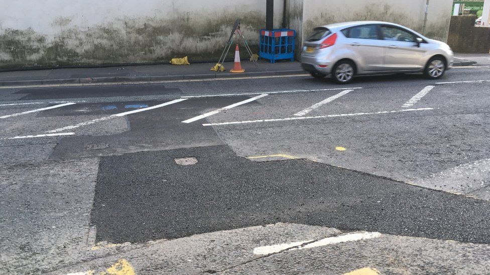 'Major void' under Hopkinstown road leads to emergency work - BBC News