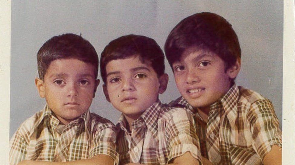 Sadiq Khan, centre, and two of his brothers