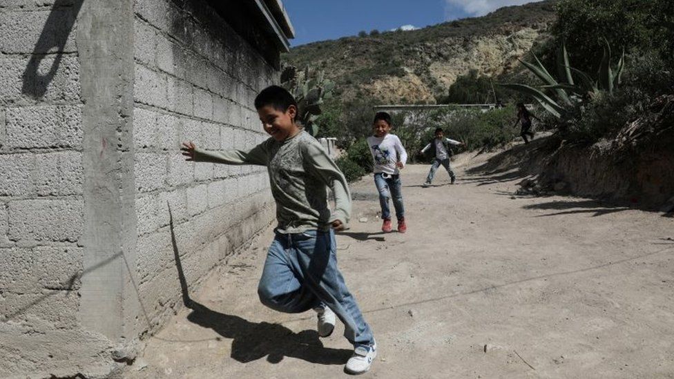 Children run home to follow a televised class as millions of students returned to classes virtually after schools were ordered into lockdown in March, due to the coronavirus disease (COVID-19) outbreak, in Chilcuautla, Hildalgo state, Mexico August 24, 2020.