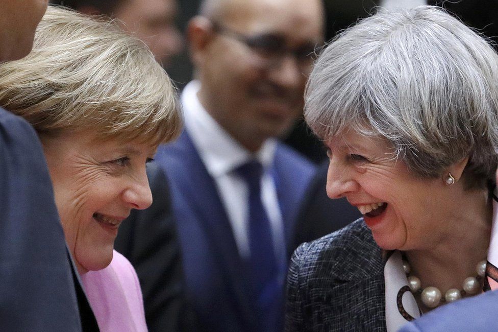 Angela Merkel (l) and Theresa May