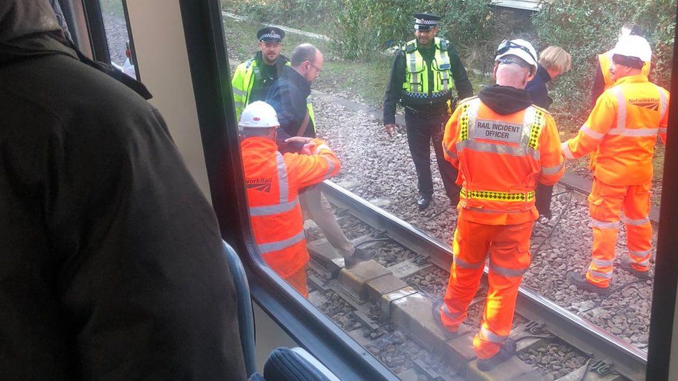 Engineers and transport police standing on the track