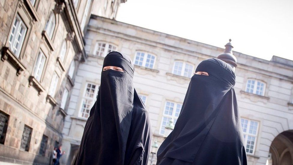 Women in niqab are pictured at Christiansborg Palace in Copenhagen, after the Danish Parliament banned the wearing of face veils in public, 31 May 2018