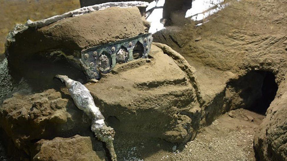 An image of partially unearthed carriage