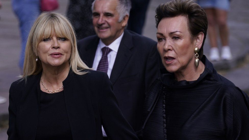 Christine Talbot (left) and Christa Ackroyd arrive at a service of thanksgiving for BBC presenter Harry Gration at York Minster in York