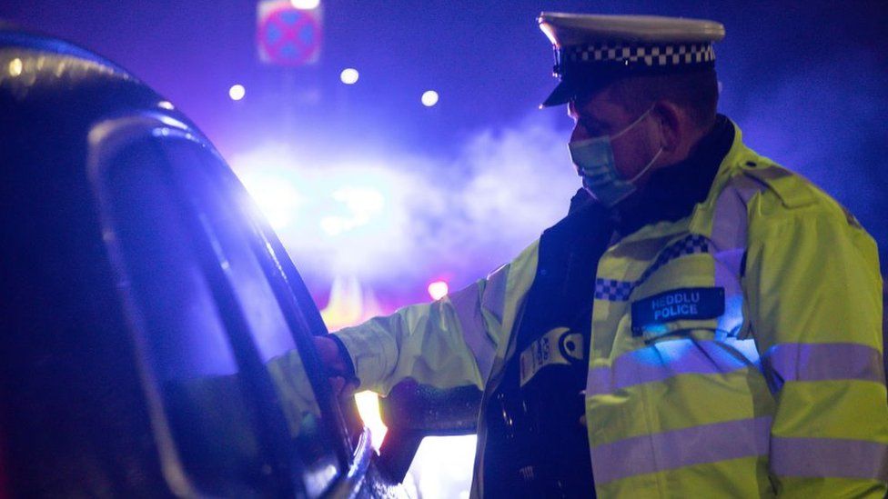 policeman stops car in Wales