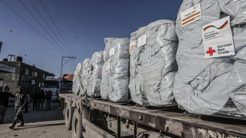 A truck loaded with German aid enters Gaza through the Kerem Shalom border crossing