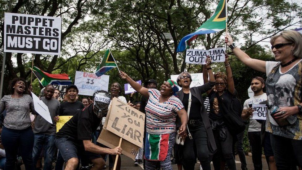 A protest outside the Gupta family compound in Johannesburg earlier this year