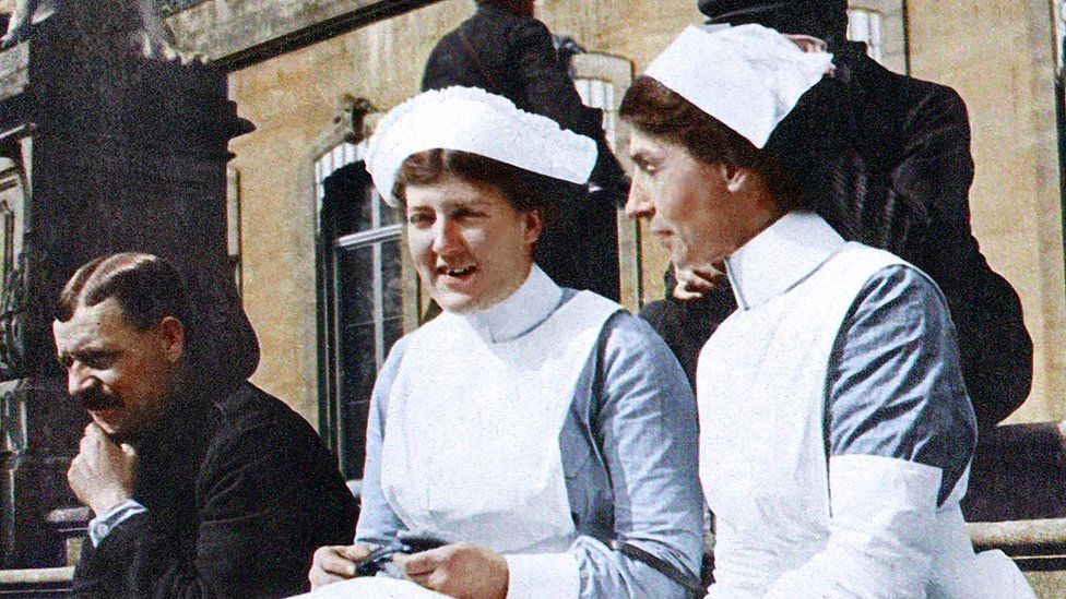 Two nurses on a step