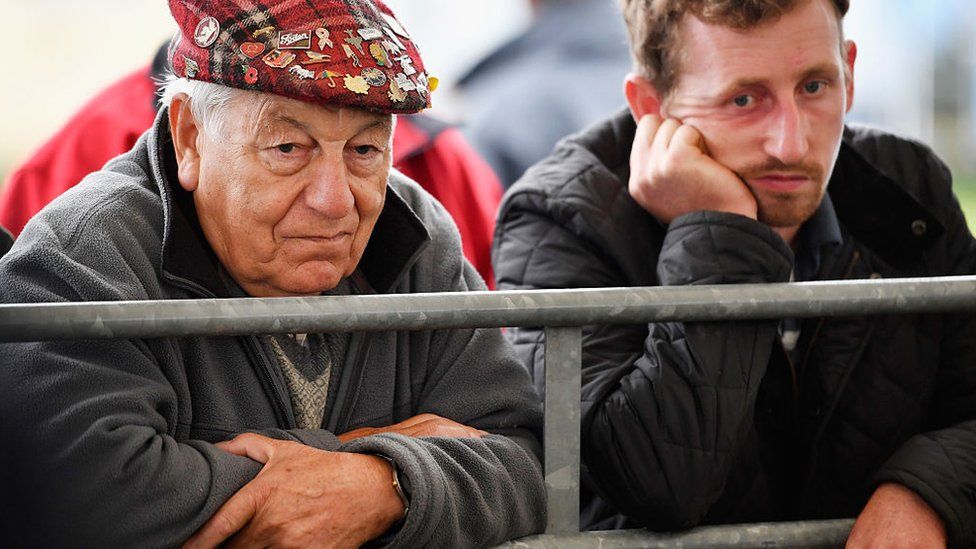 Two farmers at the Kelso ram sale in Scotland