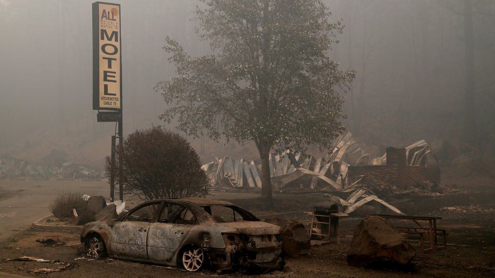 The remains of a fire damaged vehicle and a motel in the aftermath of the Beachie Creek fire in Detroit, Oregon, US, 14 September 2020
