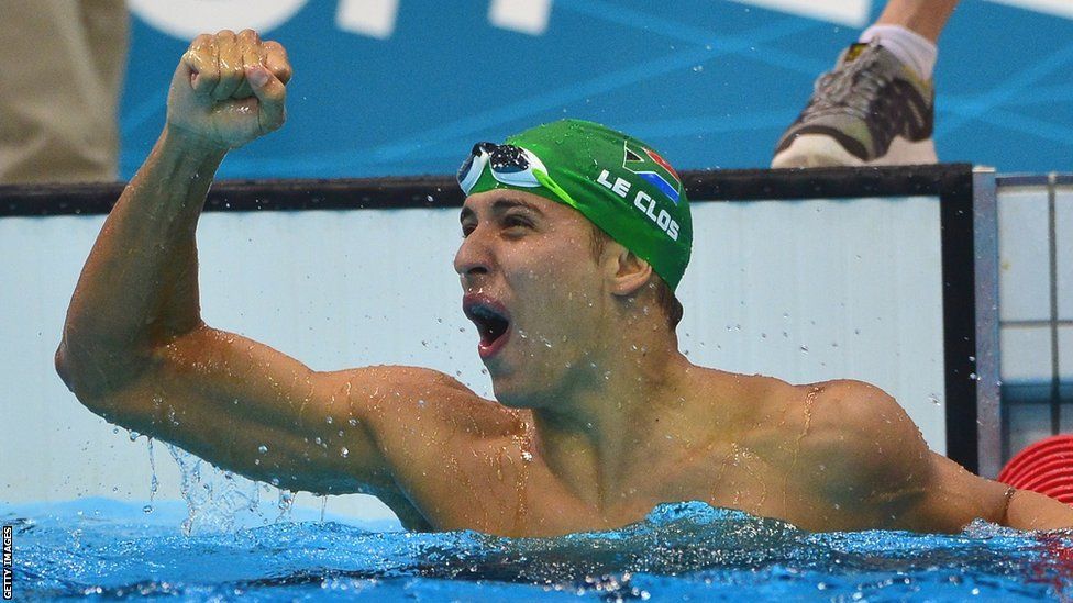 Chad Le Clos raises a fist in the air and screams in delight after winning a gold medal in the pool at the London 2012 Olympics