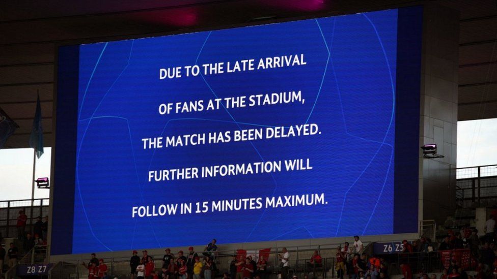 The giant screen informing fans of a delayed kick off ahead of the UEFA Champions League Final at the Stade de France