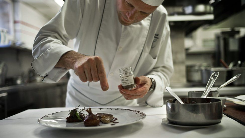 French chef Patrick Bertron adds some Poivre de Cassis, a pepper from blackcurrant bays, on May 27, 2010