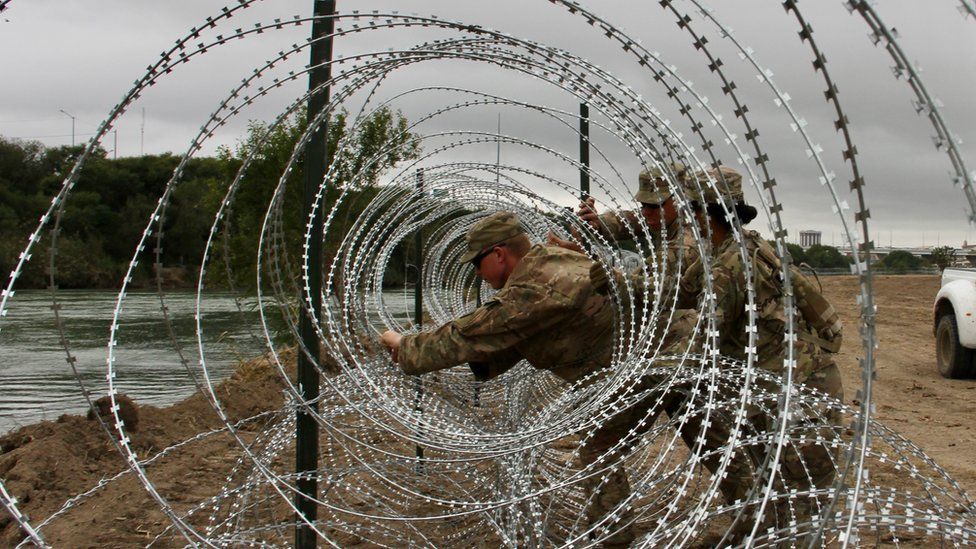 Soldiers from the Kentucky-based 19th Engineer Battalion install barbed and concertina-wire in Laredo, Texas, on November 17, 2018