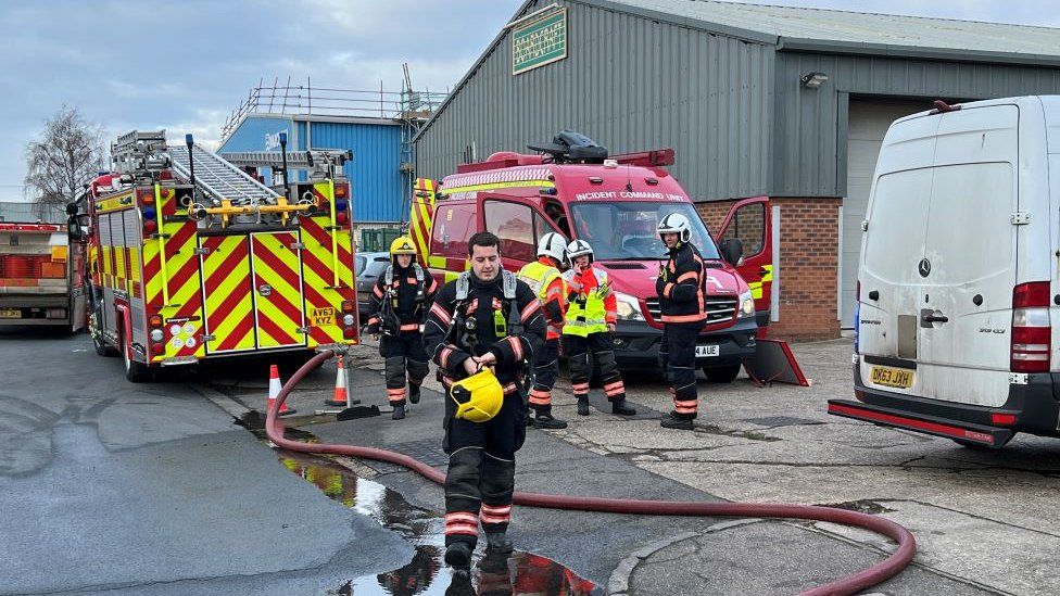 Fire fighters and appliances outside industrial unit in Eaton Socon