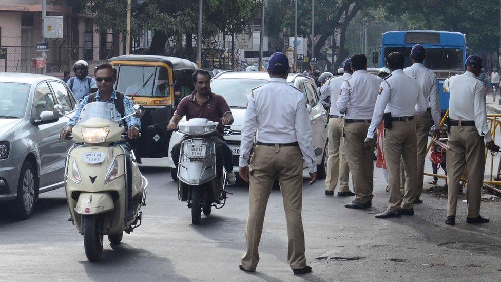 Police in Pune checking motorbike riders