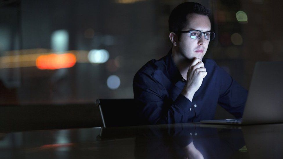 Businessman looking at laptop