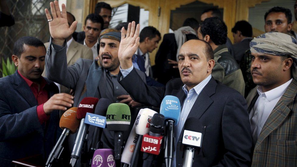 Yahya Doad, a member of the General Committee of the General People's Congress Party, and Mohammed Abdul-Salam, head of the Houthi delegation to scheduled peace talks in Kuwait, gesture after they finish a news conference at Sanaa Airport (20 April 2016)