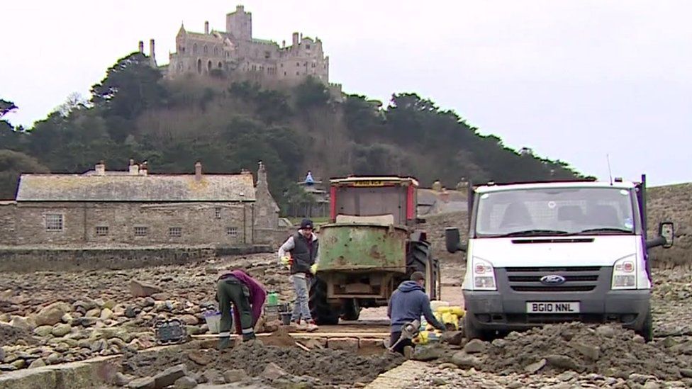 Builders working on the causeway