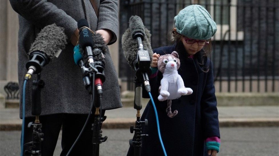 Gabriella Ratcliffe, the daughter of the jailed British-Iranian woman Nazanin Zaghari-Ratcliffe shows off the toy version of Larry the Downing Street Cat given to her during a visit in Downing Street on January 23, 2020