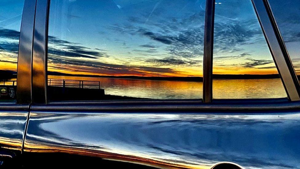 Sunset reflection on car