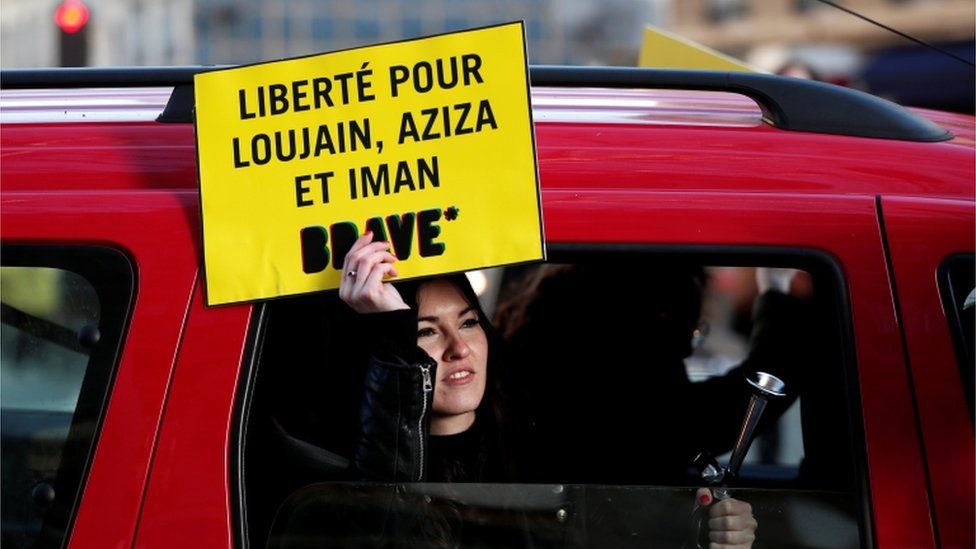 A protester in Paris calling for the release of detained Saudi women's rights activists