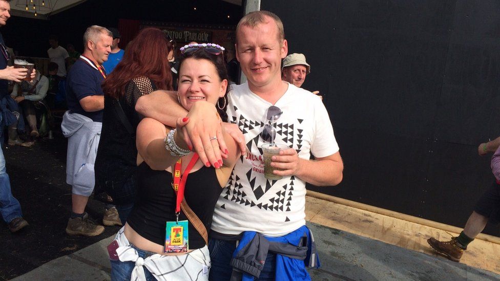 A newly engaged couple at t in the park