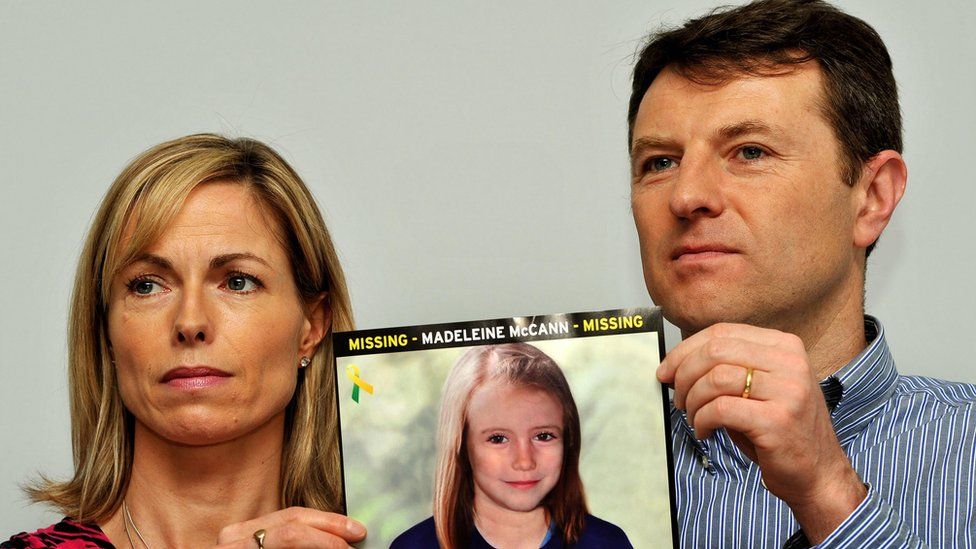 Madeleine's parents with a CGI photo of their daughter five years ago