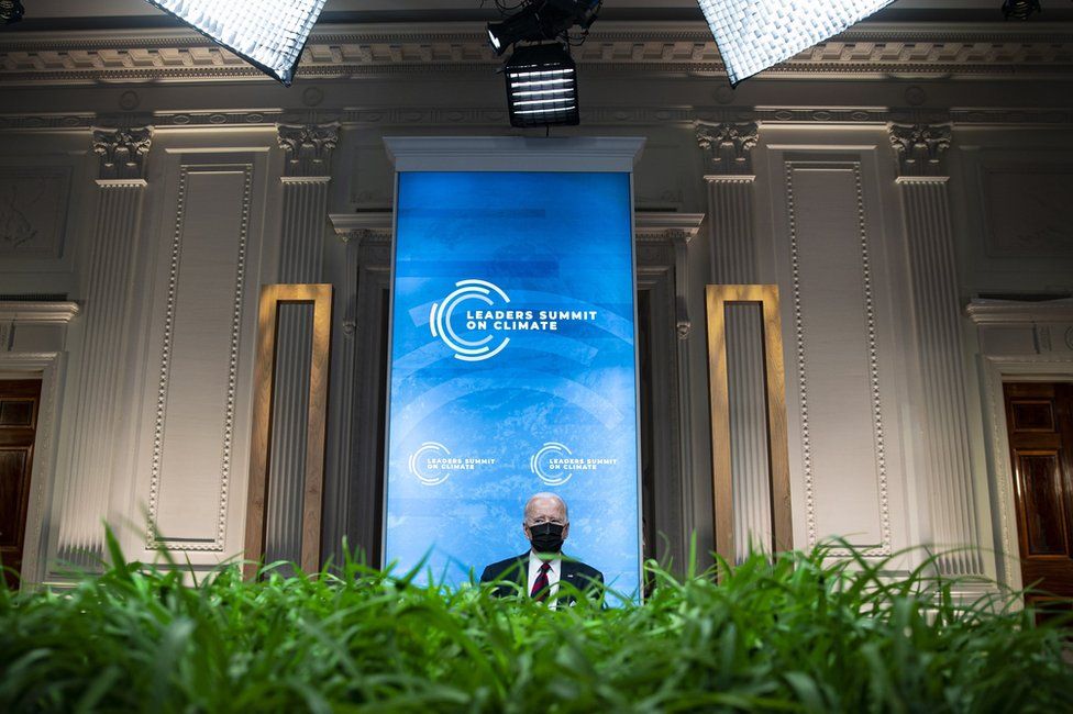 President Joe Biden wears a face mask whilst attending the virtual Leaders Summit on Climate in the White House, Washington