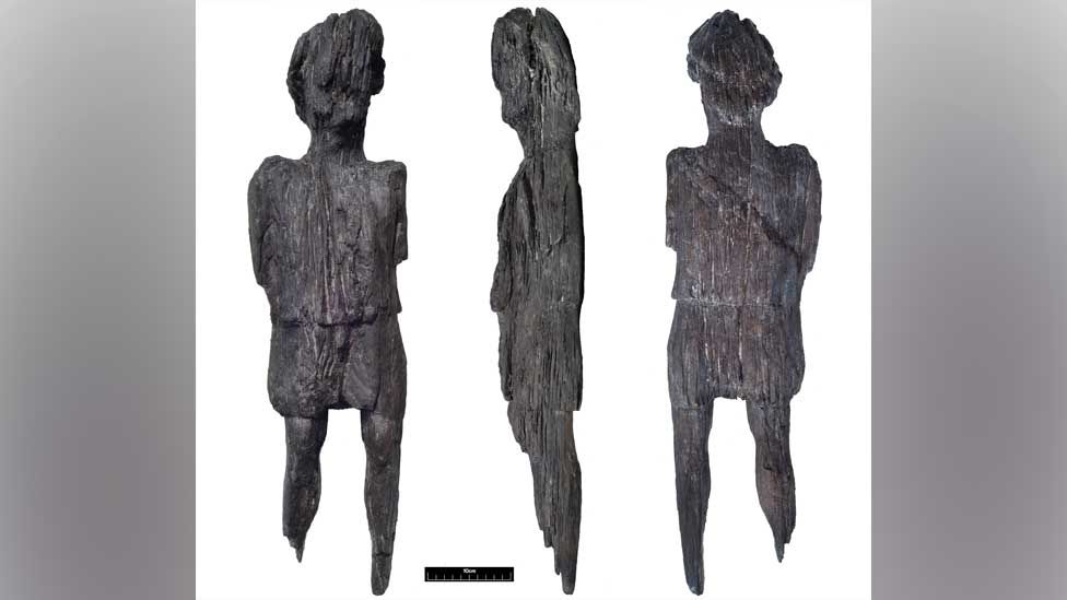 Carved wooden Roman figure