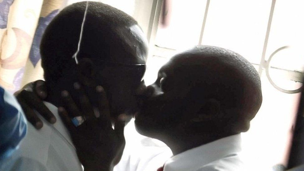 Gay men kiss in Kenya