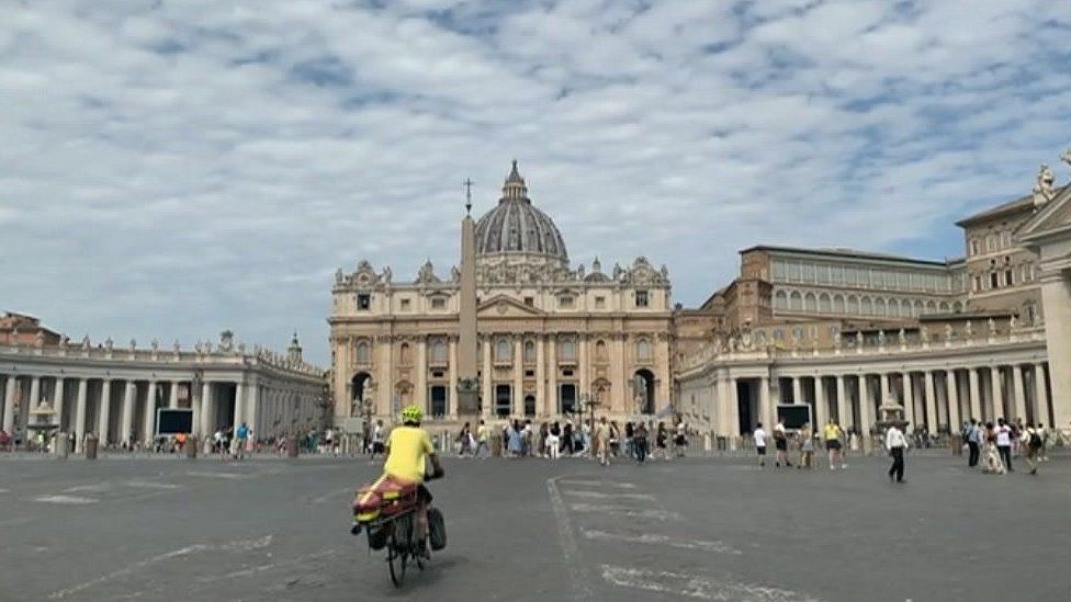 Ken cycles into St Peter's Square