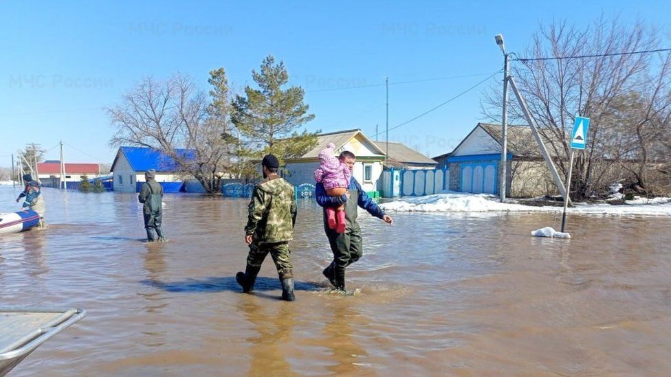 Russians being evacuated following a dam breach