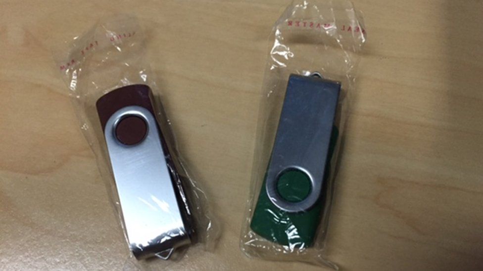 A pair of USB sticks like those left in residents' letterboxes
