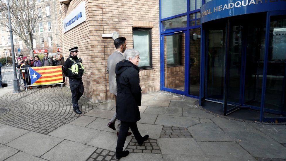 Prof Ponsati entering police station