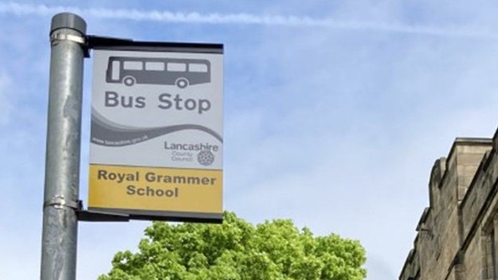 Bus stop sign which reads "Royal Grammer School"