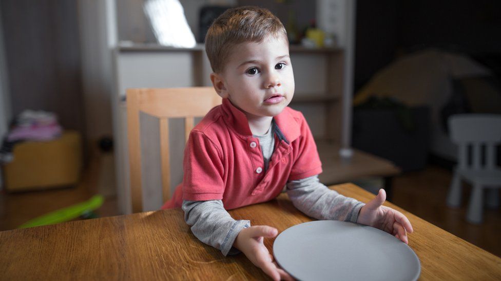 boy with empty plate