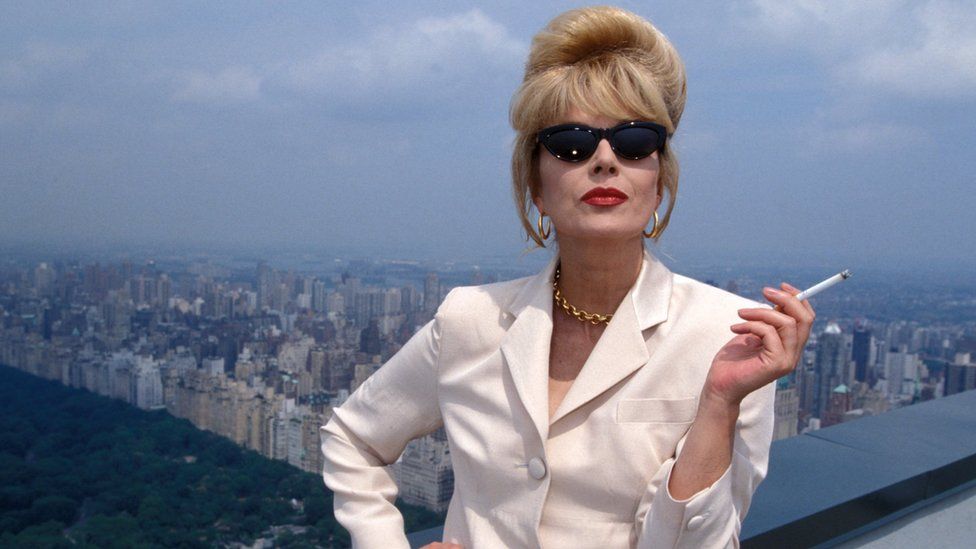 Patsy Stone posing with a cigarette