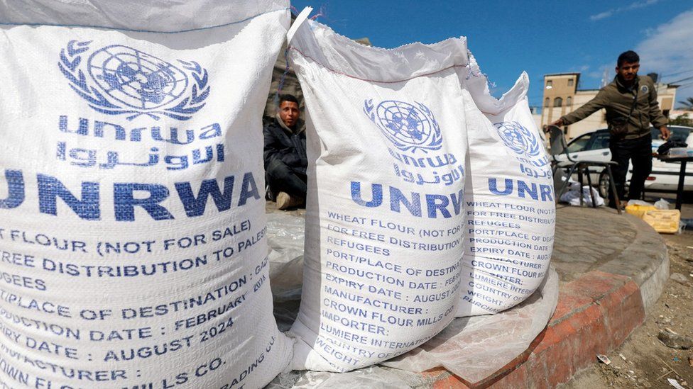 Sacks of flour, with UNRWA branding on them, sit in Rafah, southern Gaza