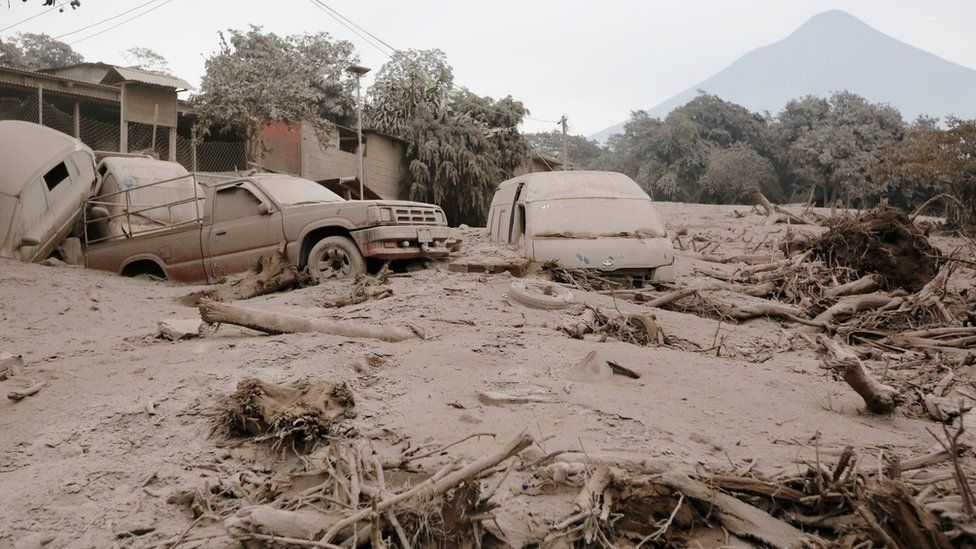 Cars and trucks jumbled up and covered with ash in San Miguel Los Lotes in Escuintla, Guatemala (June 4, 2018)