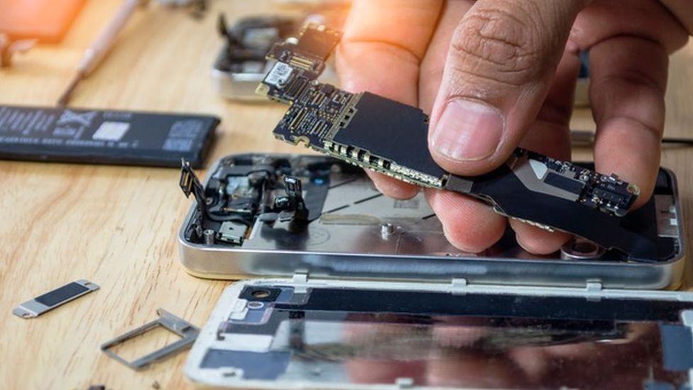 Person fixing a phone