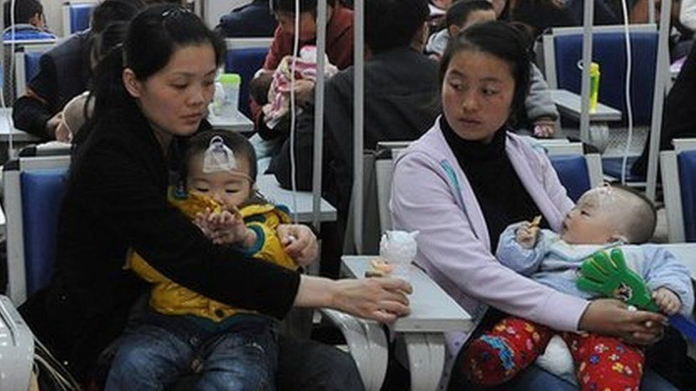 Chinese familes accompany their children as they get various injections from flu to rabies shots at a hospital in Hefei,
