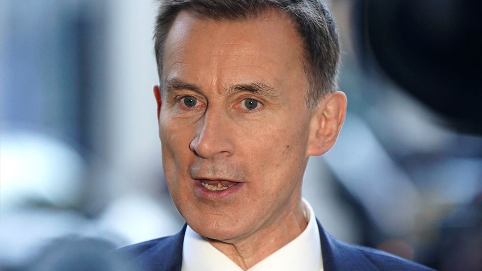Chancellor of the Exchequer Jeremy Hunt speaks to the media outside BBC Broadcasting House in London, after appearing on the BBC One current affairs programme, Sunday with Laura Kuenssberg on 19 November 2023