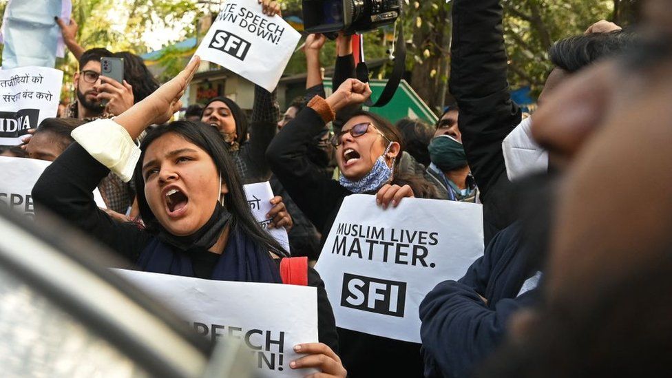 Protesters from various organisations take part in a demonstration in New Delhi on December 27, 2021, after the Indian police on December 24 said they have launched an investigation into an event where Hindu hardliners called for mass killings of minority Muslims