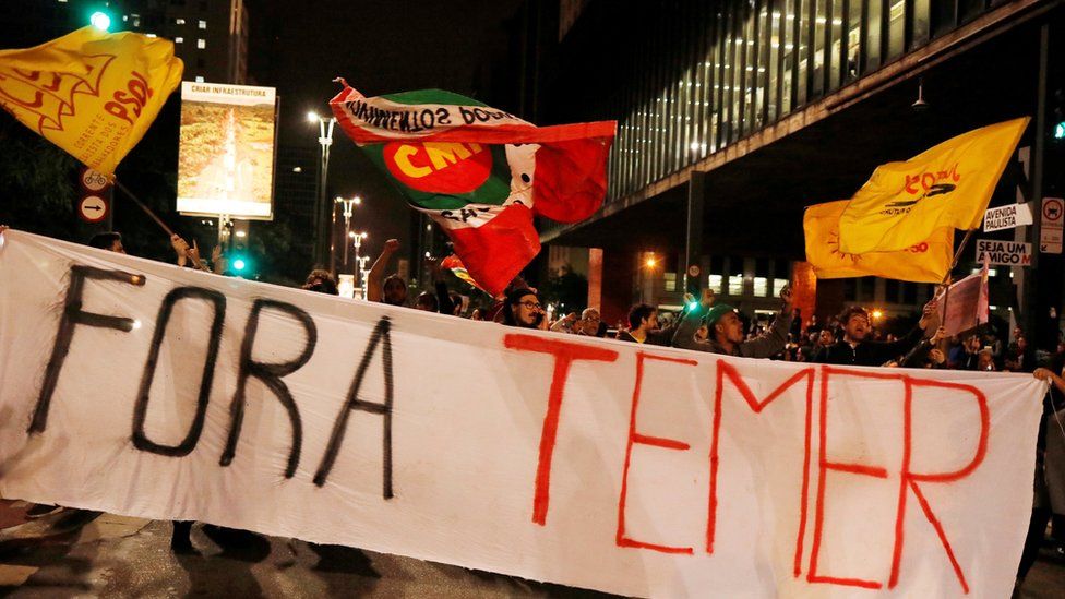 Demonstrators protest against Brazil's President Michel Temer in Sao Paulo, Brazil, May 17, 2017. The banner reads "Temer out"