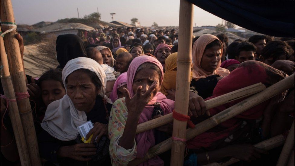 Rohingya women queue at a relief centre at the Kutupalong refugee camp in Cox's Bazar.